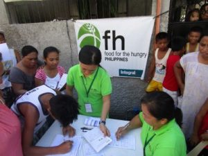 Food for the Hungry, signing people up for food distribution in Barangay Mercado, Basey, Western Samar